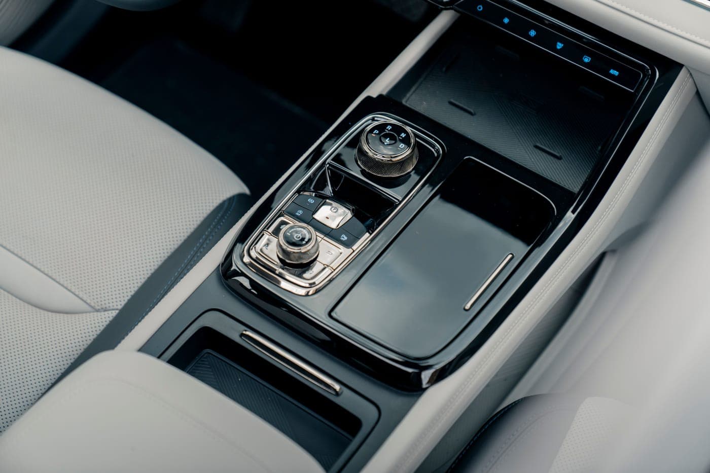 The center console and storage area of a modern car