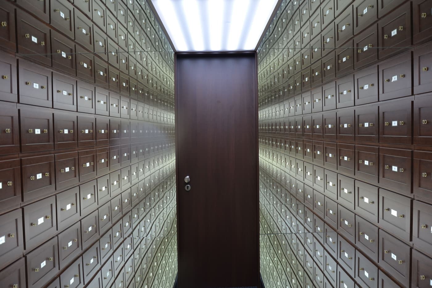 Walls of safe deposit boxes inside a bank vault