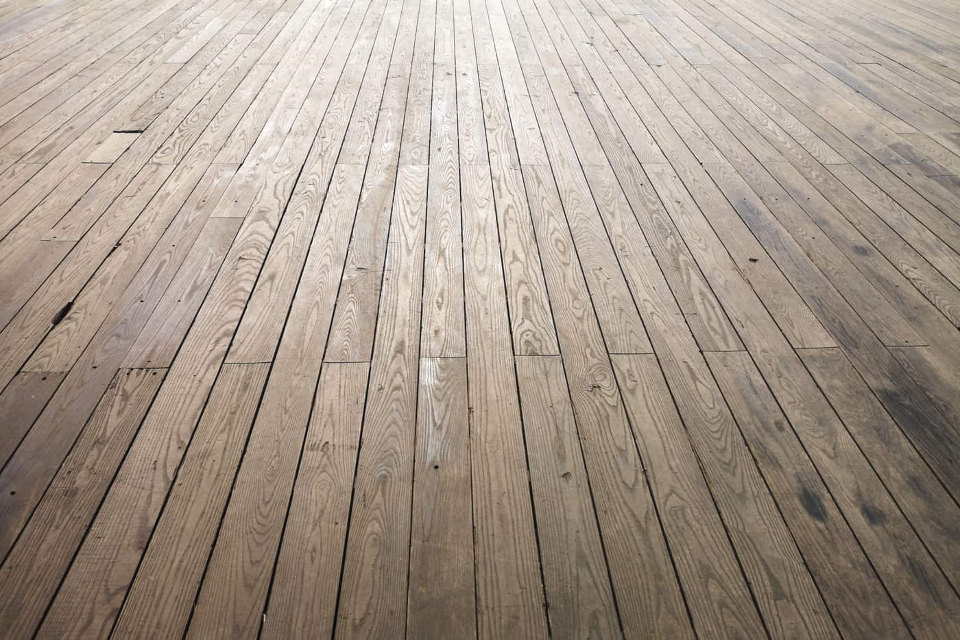 Aged wooden floor planks seen from a wide angle
