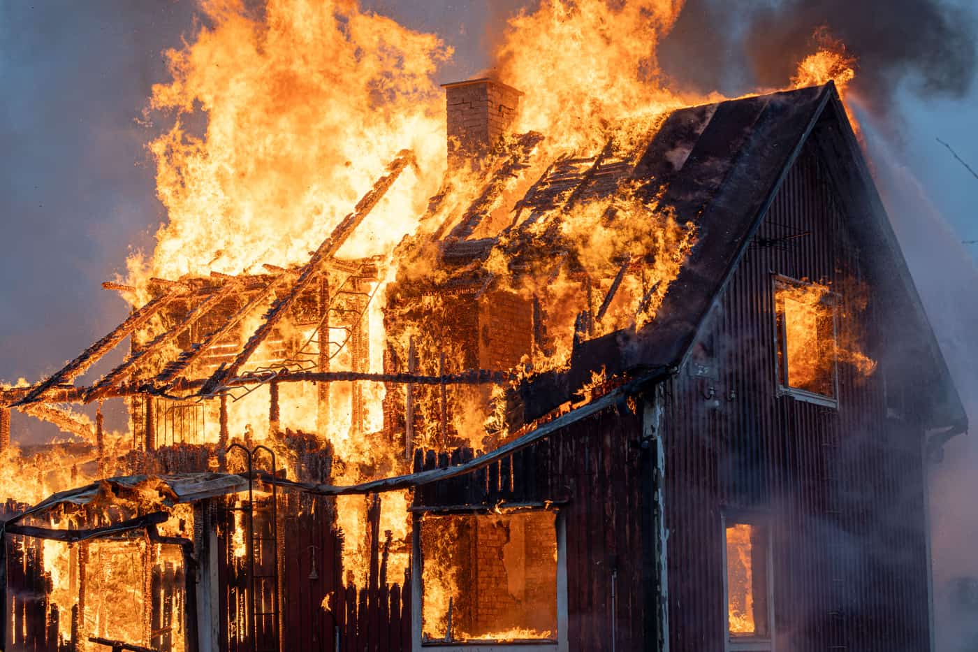 A house consumed by flames and smoke