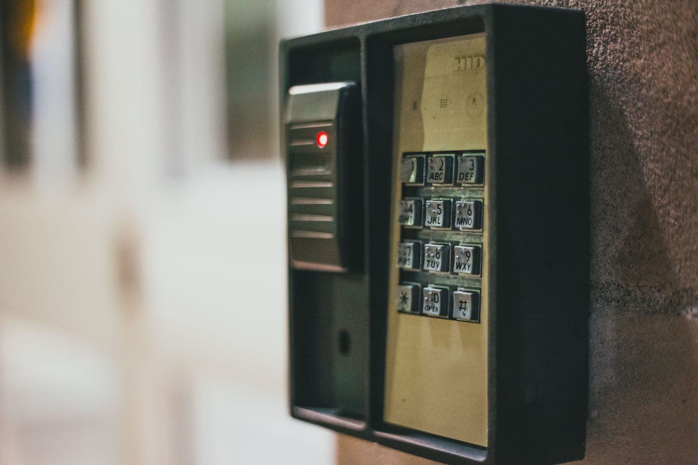 Close-up of an access-control keypad with lit buttons