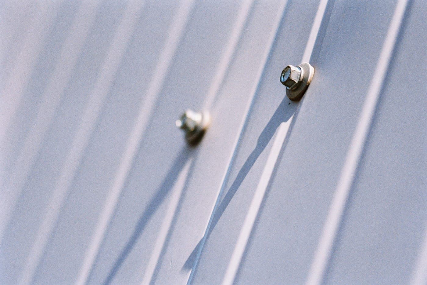 Metal screws fastening a steel sheet
