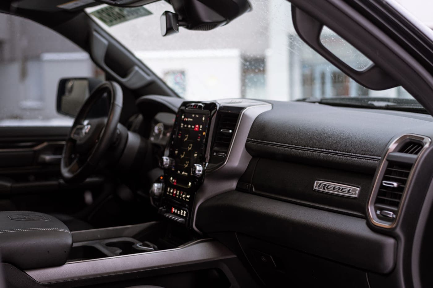 The interior of a pickup truck cab with its center console